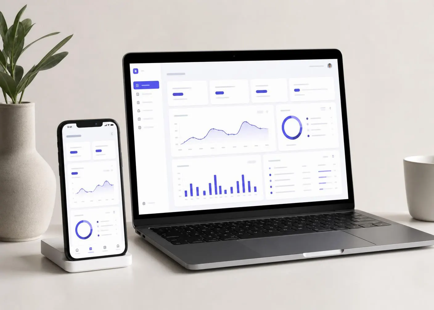 Business application shown on a laptop and smartphone